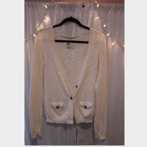 White knit cardigan with tan buttons